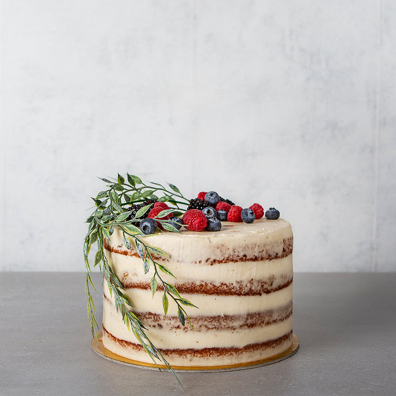 Naked celebration cake with fresh Berries