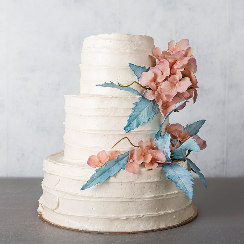 vanilla buttercream celebration cake with flowers