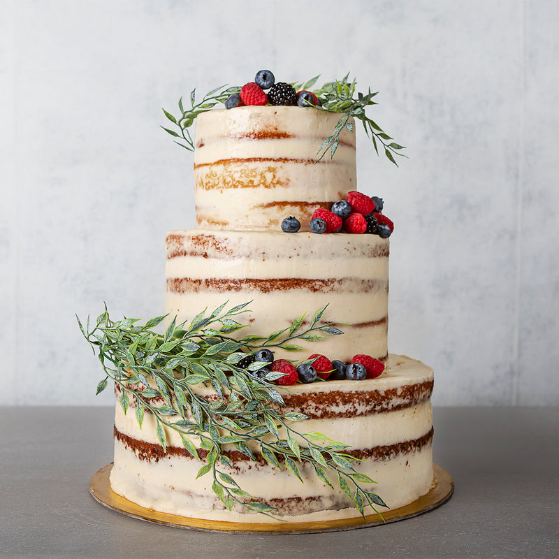 Naked celebration cake with fresh Berries